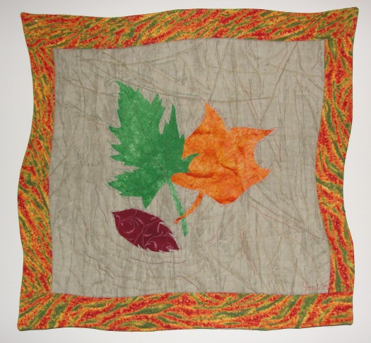First Colors of Autumn #1, rayon on cotton, 20"x 20", © 2009 Joni Beach. Fused-applique and free-motion quilting. 