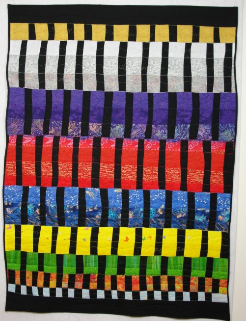 Lifeweaving #3: 9 Stages of Life, 59" x 45", rayon and metallic on cotton. Woven fabric strips, machine and free-motion quilting. (c) 2014 Joni Beach. ($2400)