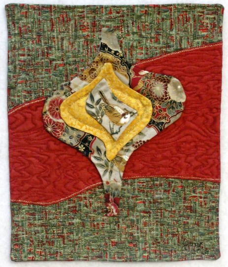 Winter Wren, rayon & metallic on cotton, 7 3/4" x 9 1/2", © 2013 Joni Beach. Faced-applique, beading, free-motion and dense stitch quilting. © 2013 Joni Beach. 